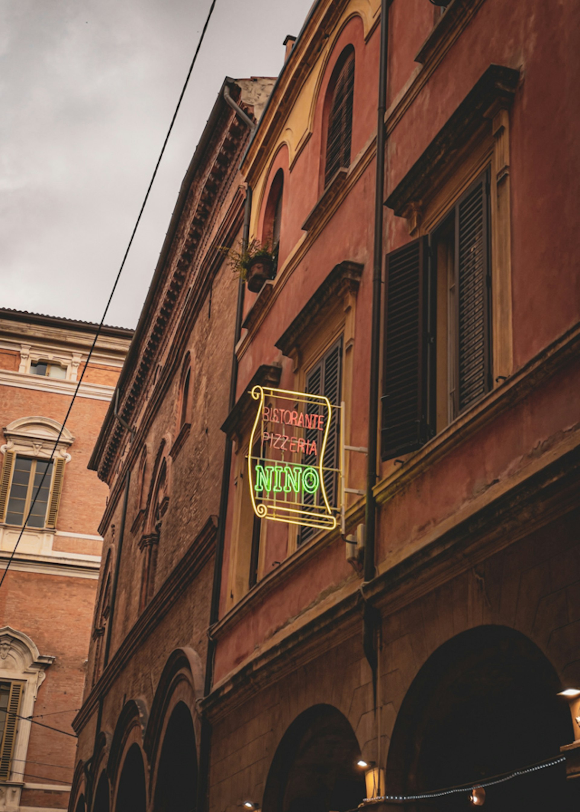 Neon sign of pizza place in Bologna